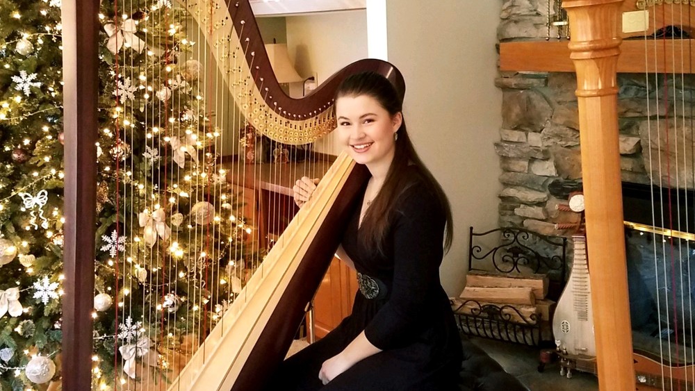 student playing the harp