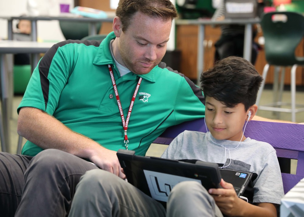 DLS helping student with device